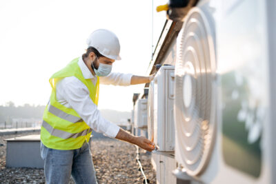 rsz man engineer in mask checking conditioner for serv utc x